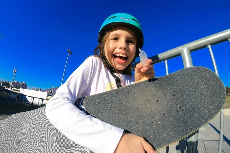 Skateboarder using a mouth guard